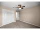 Bedroom featuring neutral walls, carpet, a ceiling fan, and closet at 7695 Sw 64Th Street Rd, Ocala, FL 34474