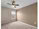 Bedroom with neutral walls, carpet and a ceiling fan with light at 7695 Sw 64Th Street Rd, Ocala, FL 34474