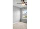 Bedroom featuring gray walls, carpet, and a ceiling fan with light at 7695 Sw 64Th Street Rd, Ocala, FL 34474