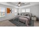 Bedroom featuring a decorative tray ceiling, a comfortable bed, and abundant natural light at 7695 Sw 64Th Street Rd, Ocala, FL 34474