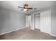 Bedroom featuring gray walls, carpet, and closet at 7695 Sw 64Th Street Rd, Ocala, FL 34474