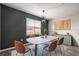 Dining room with modern light fixture, large window, and stylish decor at 7695 Sw 64Th Street Rd, Ocala, FL 34474