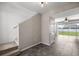 Entryway with staircase, tile floors, and door with large glass windows overlooking backyard at 7695 Sw 64Th Street Rd, Ocala, FL 34474