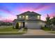Charming two-story home with a well-manicured lawn and a two-car garage in a suburban neighborhood at 7695 Sw 64Th Street Rd, Ocala, FL 34474