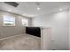 Loft area featuring neutral carpet, windows, and an accent wall at 7695 Sw 64Th Street Rd, Ocala, FL 34474