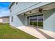 Covered patio with ceiling fans featuring sliding glass doors leading to a large backyard at 7695 Sw 64Th Street Rd, Ocala, FL 34474