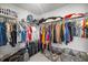 Organized walk-in closet with ample shelving, hanging rods, and storage solutions at 7695 Sw 64Th Street Rd, Ocala, FL 34474