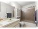 Bathroom featuring a shower and tub combination with updated lighting and cabinetry at 8850 Sw 97Th St # C, Ocala, FL 34481
