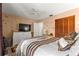 Comfortable bedroom with neutral walls, ceiling fan, and plenty of closet space at 8850 Sw 97Th St # C, Ocala, FL 34481