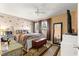 Comfortable bedroom featuring neutral walls, ample natural light and updated ceiling fan at 8850 Sw 97Th St # C, Ocala, FL 34481