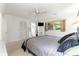Bedroom showcasing ceiling fan, natural light, closet storage and comfortable bed at 8850 Sw 97Th St # C, Ocala, FL 34481