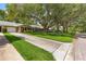 Street view of homes with mature trees providing shade at 8850 Sw 97Th St # C, Ocala, FL 34481