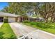 Charming street view highlighting manicured lawns and mature trees at 8850 Sw 97Th St # C, Ocala, FL 34481
