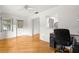 Bright living room with hardwood floors, neutral walls, and a ceiling fan at 8850 Sw 97Th St # C, Ocala, FL 34481