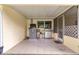 Screened-in patio with a grill and comfortable space for outdoor cooking and dining at 8850 Sw 97Th St # C, Ocala, FL 34481