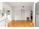Bright, open area with wood-look flooring, a closet, and access to additional rooms at 8850 Sw 97Th St # C, Ocala, FL 34481
