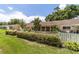 Townhome backyard featuring a white fence and a well-maintained shrub border at 8881 Sw 94Th St # E, Ocala, FL 34481