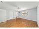 Bedroom with wood look flooring, walk-in closet, and large window at 8881 Sw 94Th St # E, Ocala, FL 34481