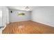 Bedroom with wood look flooring and a view of backyard at 8881 Sw 94Th St # E, Ocala, FL 34481
