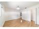Bright bedroom with wood-look floors and closet access at 8881 Sw 94Th St # E, Ocala, FL 34481