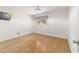Bedroom with wood-look floors and a window with natural light at 8881 Sw 94Th St # E, Ocala, FL 34481