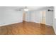 Bedroom with wood look flooring and ensuite bathroom at 8881 Sw 94Th St # E, Ocala, FL 34481