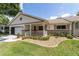 Charming single-story home with a cozy front porch and well-manicured landscaping at 8881 Sw 94Th St # E, Ocala, FL 34481