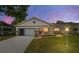 Charming single-story home with a cozy front porch, garage, and well-manicured landscaping at 8881 Sw 94Th St # E, Ocala, FL 34481