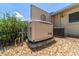 Home exterior featuring a Generac generator set on a gravel base at 8881 Sw 94Th St # E, Ocala, FL 34481