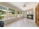Bright sunroom with full windows and an antique bar at 8881 Sw 94Th St # E, Ocala, FL 34481