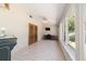 Bright sunroom with full windows and french doors to another room at 8881 Sw 94Th St # E, Ocala, FL 34481