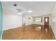 Living room featuring wood floors and an entryway with door, letting in natural light at 8881 Sw 94Th St # E, Ocala, FL 34481