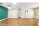 Open living room featuring hardwood floors, recessed lighting, and a TV wall mount at 8881 Sw 94Th St # E, Ocala, FL 34481