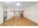 Bright living room featuring wood floors, window views, and recessed lights at 8881 Sw 94Th St # E, Ocala, FL 34481