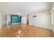 Open living room featuring wood floors, an accent wall, and recessed lighting at 8881 Sw 94Th St # E, Ocala, FL 34481