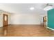 Well-lit living room showcasing the hardwood floors and open layout at 8881 Sw 94Th St # E, Ocala, FL 34481