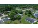Aerial view of a peaceful neighborhood surrounded by lush green trees and well-maintained homes at 8973 Sw 104Th Pl, Ocala, FL 34481