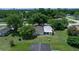 An aerial view reveals a well-kept home with a fenced backyard amidst a serene neighborhood at 8973 Sw 104Th Pl, Ocala, FL 34481