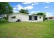 Back exterior of home showing a fenced yard and porch at 8973 Sw 104Th Pl, Ocala, FL 34481