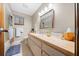 Bright bathroom with a long vanity, neutral walls, and a shower/tub combo at 8973 Sw 104Th Pl, Ocala, FL 34481