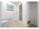 Clean bathroom with shower and shelving, offering practical storage solutions at 8973 Sw 104Th Pl, Ocala, FL 34481