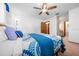 Comfortable bedroom with ceiling fan and ensuite bathroom access at 8973 Sw 104Th Pl, Ocala, FL 34481