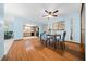 Dining room with wood floors and open floor plan to living room and kitchen at 8973 Sw 104Th Pl, Ocala, FL 34481