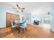 Open dining room featuring hardwood floors and views of the living and kitchen area at 8973 Sw 104Th Pl, Ocala, FL 34481