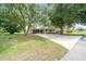 Charming single-story home with a long driveway and mature trees providing ample shade at 8973 Sw 104Th Pl, Ocala, FL 34481