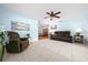 Cozy living room featuring tile floors, lots of natural light, and comfortable furniture at 8973 Sw 104Th Pl, Ocala, FL 34481