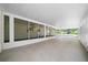 Spacious screen porch featuring tile floors and a great space for relaxing or entertaining at 8973 Sw 104Th Pl, Ocala, FL 34481