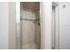 Tiled shower with built-in shelf and shower head at 8973 Sw 104Th Pl, Ocala, FL 34481