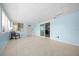Bright sunroom with tile flooring and a sliding glass door to the exterior at 8973 Sw 104Th Pl, Ocala, FL 34481