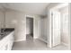 An en-suite bath boasts granite countertops, tiled floors, and a walk-in closet by a glass shower at 9209 Sw 58Th Cir, Ocala, FL 34476